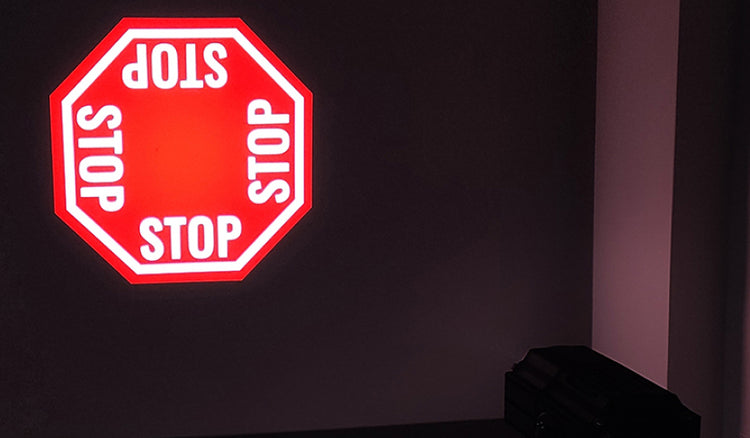 Floor and wall globo warning projector